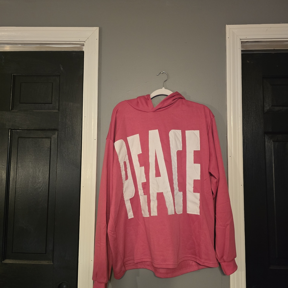 Pink Hoodie with 'PEACE' Graphic